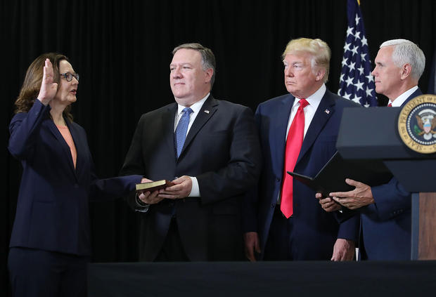 Gina Haspel (L) is sworn in as CIA director 