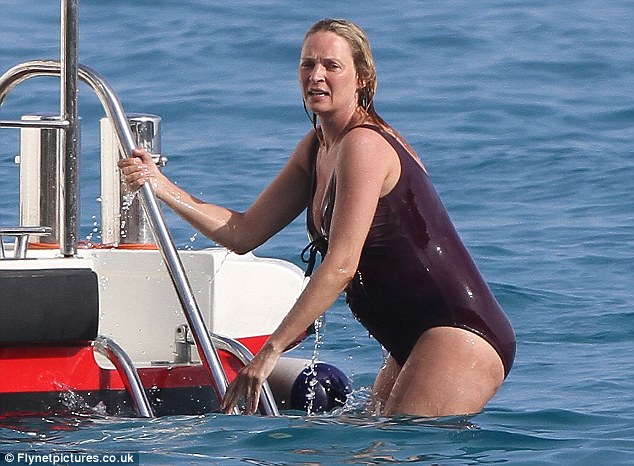 Baby on board: The actress looked refreshed after a cooling swim in the Caribbean sea