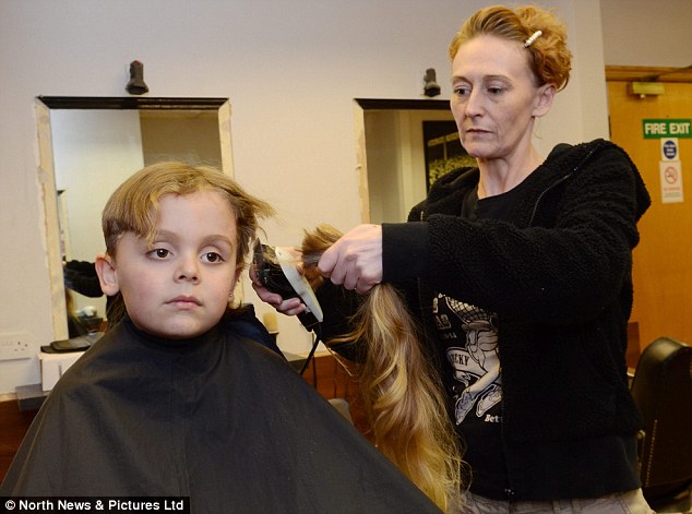 Big job: Rean Carter has had his locks shorn for charity after being teased at school